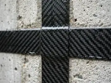 Aerospace-grade carbon fiber structural reinforcement grid strap bonded to concrete wall